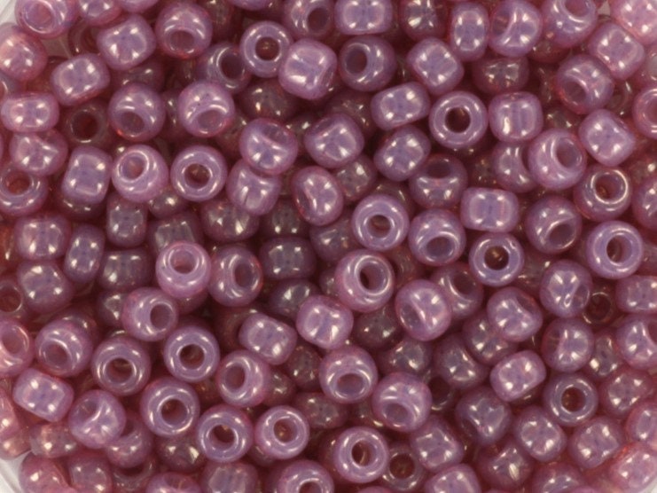 Translucent shiny purple seed beads. Each bead is 3mm big, round in shape and the hole is 1,1mm big.