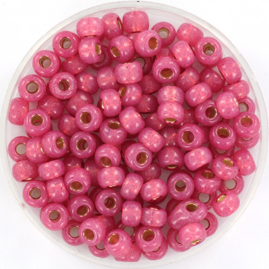 Pink seed beads silverlined, 4mm in size and round in shape.