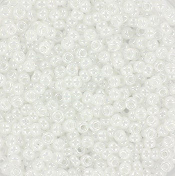 White seed beads with a shiny luster. The beads are 2mm big and round in shape.