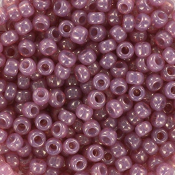 Translucent shiny purple seed beads. Each bead is 3mm big, round in shape and the hole is 1,1mm big.