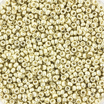 Metallic silver seed beads, 1.5mm in size and round in shape. The image is a close-up of a bowl of full of seed beads so that the beads fill the entire image