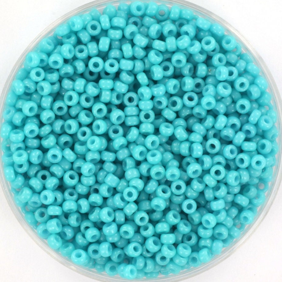 Intense turquoise blue seed beads. 2mm in size and round in shape. Bead hole size is 0.8mm