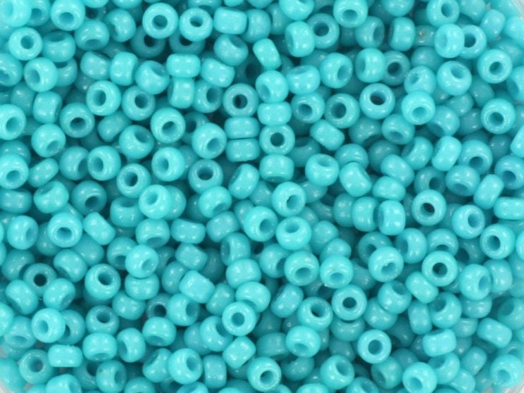 Intense turquoise blue seed beads. 2mm in size and round in shape. Bead hole size is 0.8mm