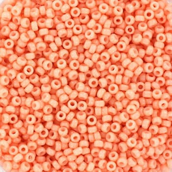 Light pink seed beads. The beads are made of glass. Each bead measures 1.5mm and has a 0.7mm hole.