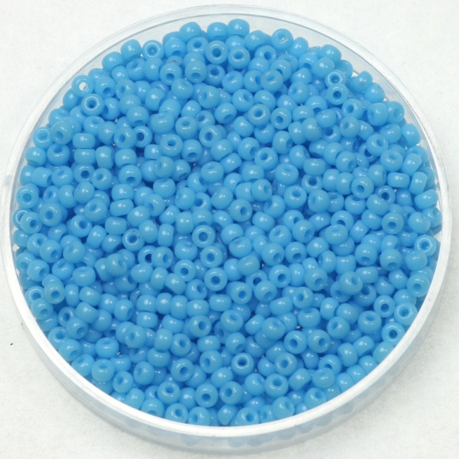 Turquoise blue round beads, 2mm big, round shape. The beads are opaque and polished.