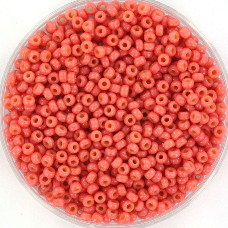 Miyuki duracaot opaque light watermelon seed beads, size 11/0. 2mm small round glass beads. Light red beads. Color code 4464.