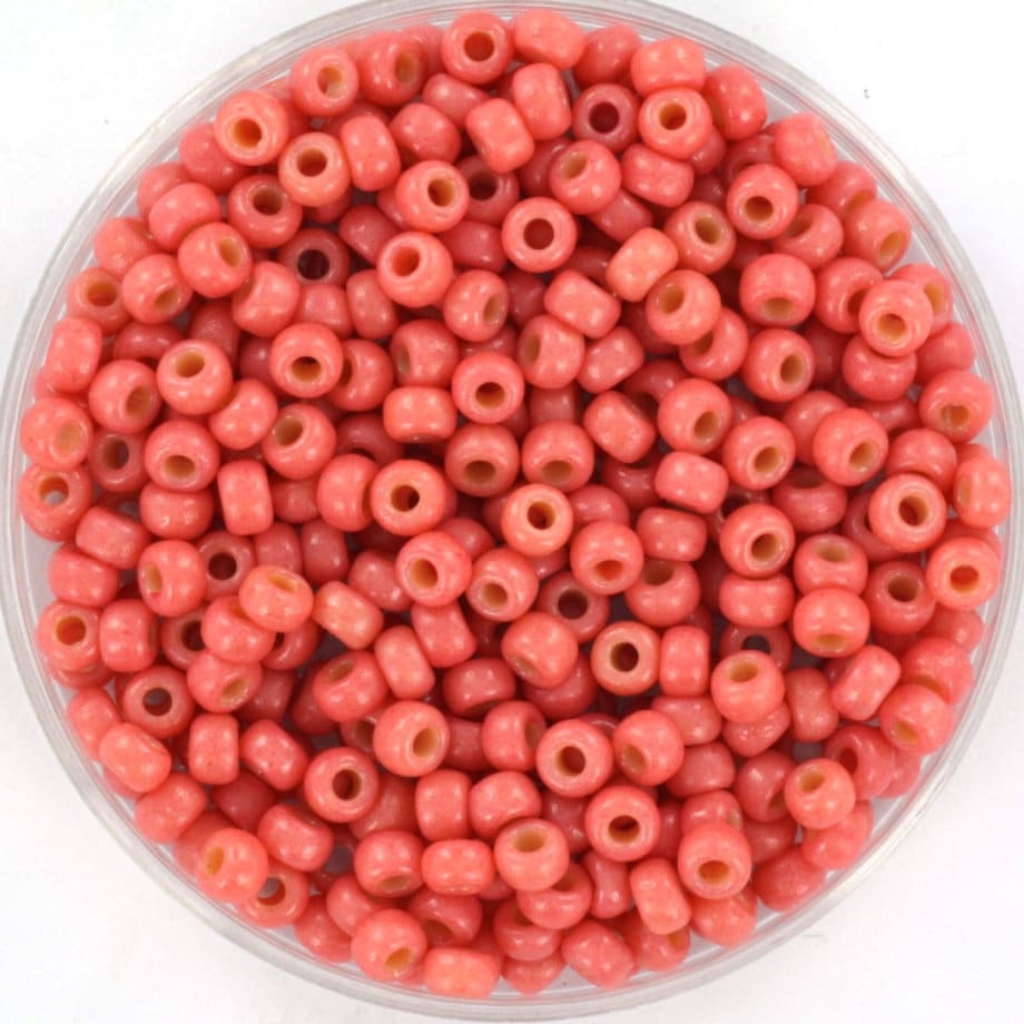 Miyuki duracaot opaque light watermelon seed beads, size 8/0. 3mm small round glass beads. Light red beads. Color code 4464.