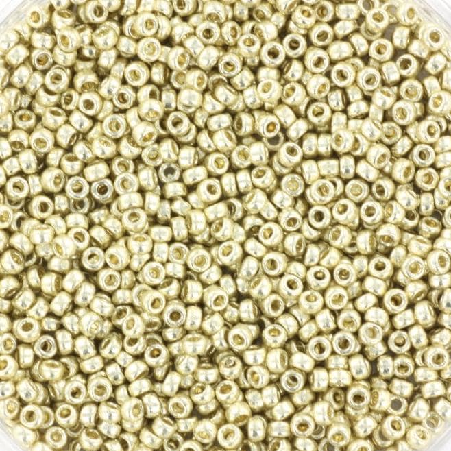 Metallic silver seed beads, 1.5mm in size and round in shape. The image shows a round bowl full of seed beads on a white background